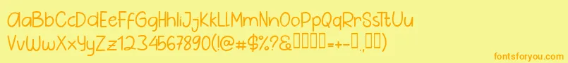 フォントPig Year Sans – オレンジの文字が黄色の背景にあります。
