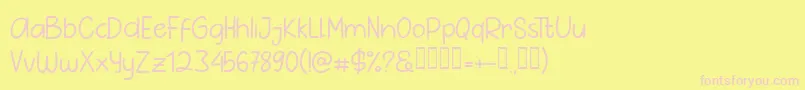 Pig Year Sans-fontti – vaaleanpunaiset fontit keltaisella taustalla