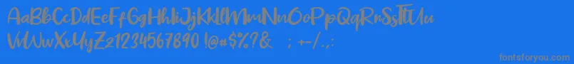 フォントPig Year – 青い背景に灰色の文字