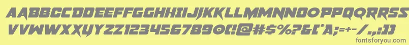 フォントpistoleerexpandital – 黄色の背景に灰色の文字