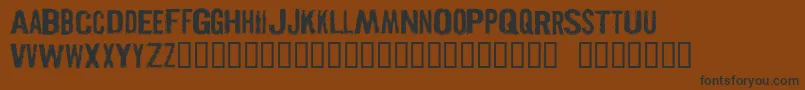 PISTOLGR-Schriftart – Schwarze Schriften auf braunem Hintergrund