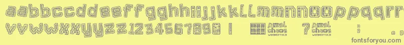 Pixel Chaos-Schriftart – Graue Schriften auf gelbem Hintergrund