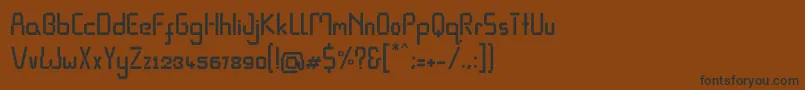 フォントPixel Rand – 黒い文字が茶色の背景にあります