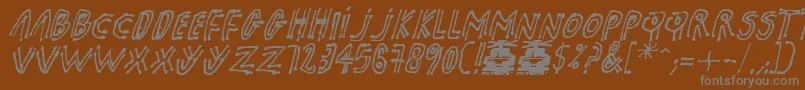 pk shaman Font – Gray Fonts on Brown Background