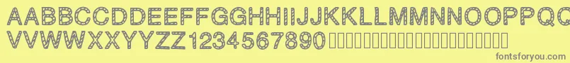 PLAQUEZIP Font – Gray Fonts on Yellow Background
