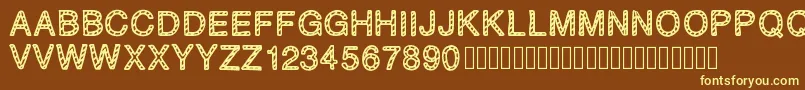 PLAQUEZIP Font – Yellow Fonts on Brown Background