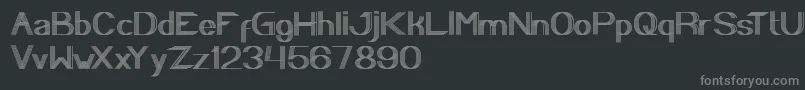 PLAYGROUND-fontti – harmaat kirjasimet mustalla taustalla