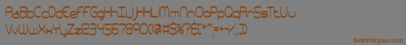 フォントpneutall – 茶色の文字が灰色の背景にあります。