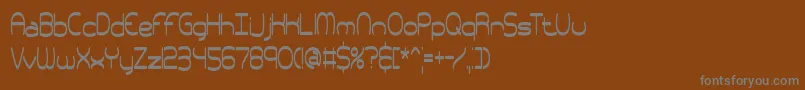 フォントpneutall – 茶色の背景に灰色の文字