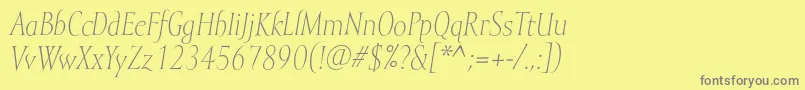 MramorlightItalic-fontti – harmaat kirjasimet keltaisella taustalla