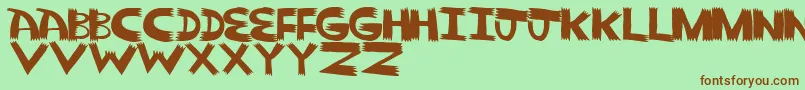 Pointy Solid-fontti – ruskeat fontit vihreällä taustalla