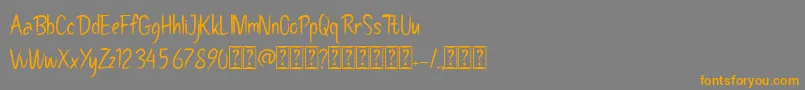 Pollaroidフォントについての詳細 フォントPollaroid – オレンジの文字は灰色の背景にあります。