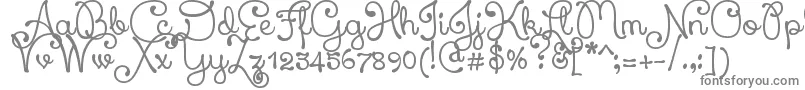 Xiomara-fontti – harmaat kirjasimet valkoisella taustalla
