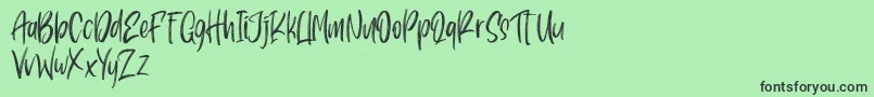 Pondspell Font – Black Fonts on Green Background