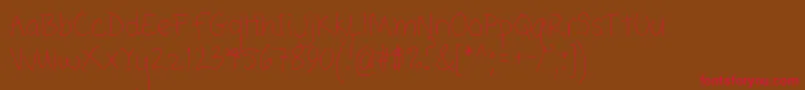 Popcorn Mountain  Condensed Thin Font – Red Fonts on Brown Background