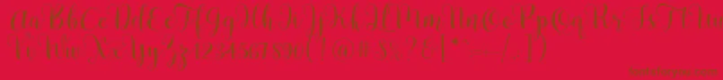 Czcionka Pradyse Script Free Demo – brązowe czcionki na czerwonym tle