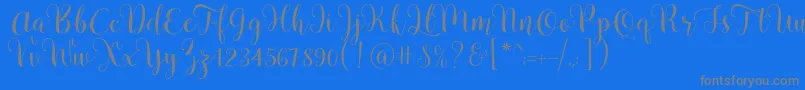 Pradyse Script Free Demo-fontti – harmaat kirjasimet sinisellä taustalla