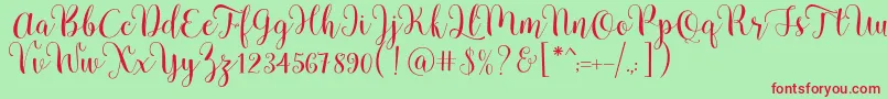 Pradyse Script Free Demo Font – Red Fonts on Green Background