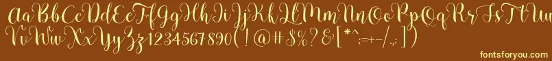 Pradyse Script Free Demo-fontti – keltaiset fontit ruskealla taustalla