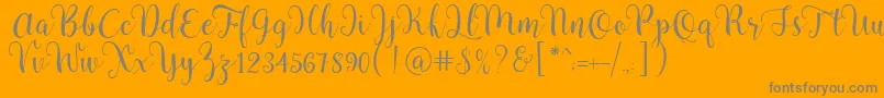 Pradyse Script Free Demo-Schriftart – Graue Schriften auf orangefarbenem Hintergrund