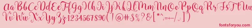 Pradyse Script Free Demo-Schriftart – Rote Schriften auf rosa Hintergrund