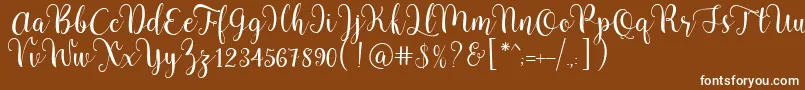 Pradyse Script Free Demo-fontti – valkoiset fontit ruskealla taustalla