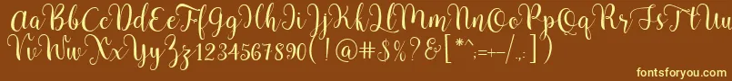 Pradyse Script Free Demo Font – Yellow Fonts on Brown Background