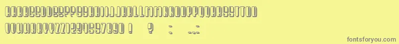 President Condensed-fontti – harmaat kirjasimet keltaisella taustalla