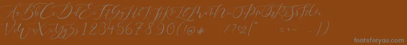 フォントPretty Women script – 茶色の背景に灰色の文字