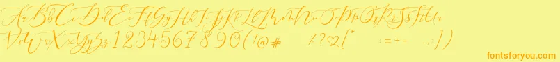 フォントPretty Women script – オレンジの文字が黄色の背景にあります。