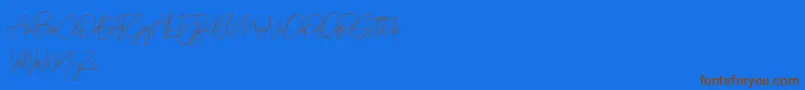 Prettygirlfree Font – Brown Fonts on Blue Background