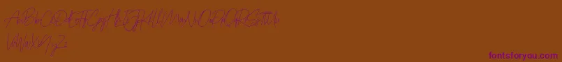 Prettygirlfree Font – Purple Fonts on Brown Background