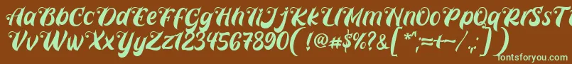 フォントPrettyla Font By 7NTypes D – 緑色の文字が茶色の背景にあります。