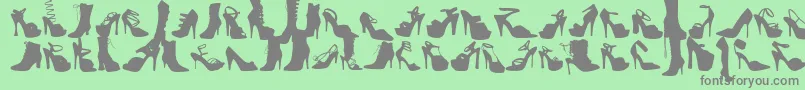 WcFetishBta-Schriftart – Graue Schriften auf grünem Hintergrund