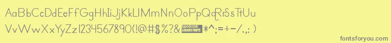 primer print-fontti – harmaat kirjasimet keltaisella taustalla