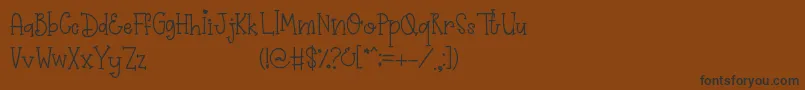 フォントPrimrose – 黒い文字が茶色の背景にあります