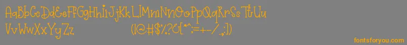 フォントPrimrose – オレンジの文字は灰色の背景にあります。