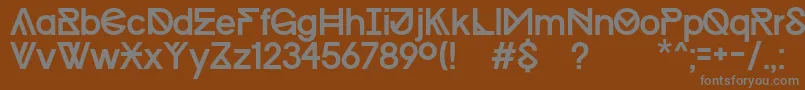 Progress Regular MAC   Kopie-fontti – harmaat kirjasimet ruskealla taustalla