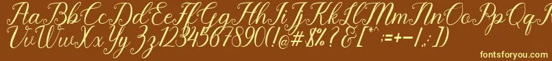 Pruistine Script-Schriftart – Gelbe Schriften auf braunem Hintergrund