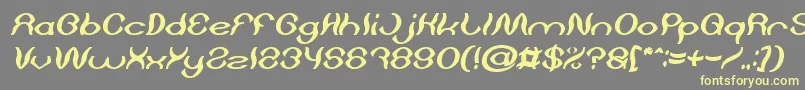 Czcionka Psychedelic Bold Italic – żółte czcionki na szarym tle