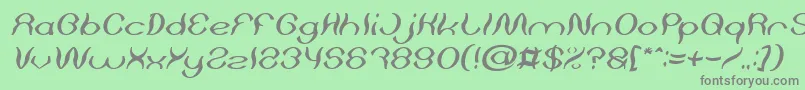 Psychedelic Italic-fontti – harmaat kirjasimet vihreällä taustalla