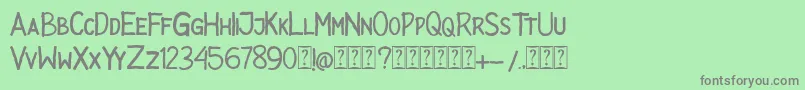 フォントPSYCHOPAT – 緑の背景に灰色の文字