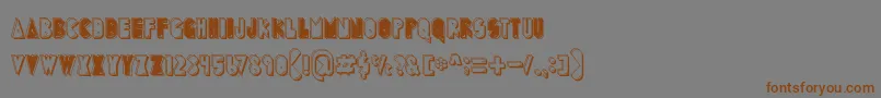 Шрифт PuckMan – коричневые шрифты на сером фоне