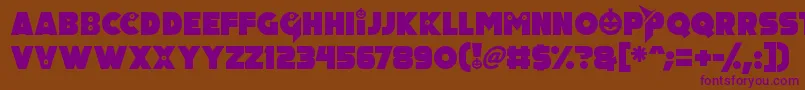 Czcionka Pumpkin King – fioletowe czcionki na brązowym tle