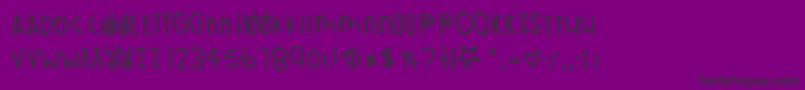 フォントPumpkinSeeds – 紫の背景に黒い文字
