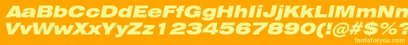 Fonte HeliosextblackcItalic – fontes amarelas em um fundo laranja