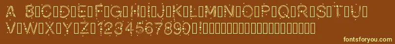 PWChristmasStars-fontti – keltaiset fontit ruskealla taustalla