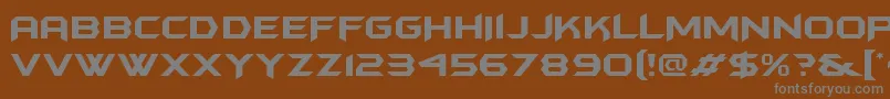 Batmanforeveralternate-fontti – harmaat kirjasimet ruskealla taustalla