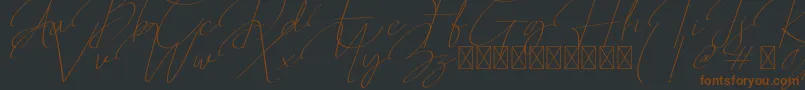 Шрифт Qalistha – коричневые шрифты на чёрном фоне