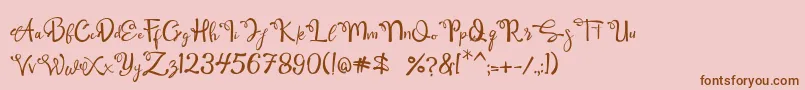 Fonte Qamari Script – fontes marrons em um fundo rosa